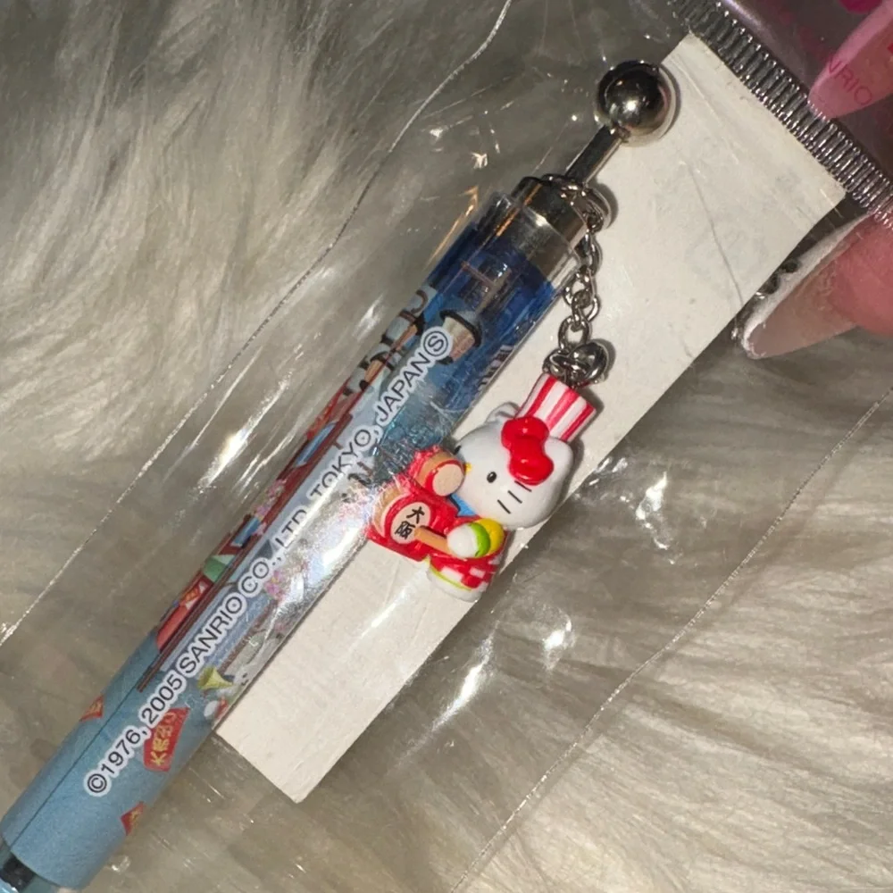 Sanrio Hello Kitty Blue Pen with Red Charm - Picture 1 of 4